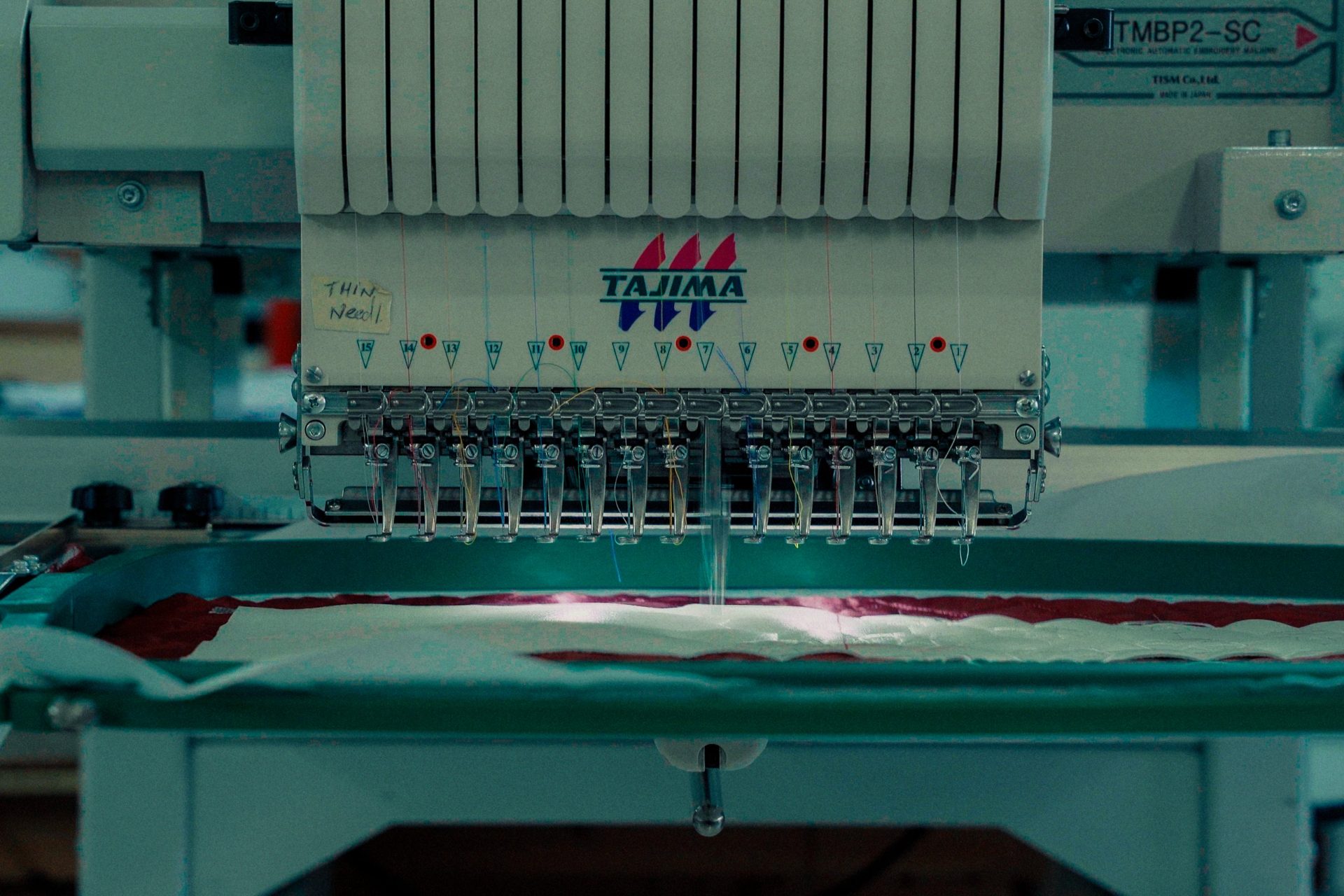 Close-up of an embroidery machine stitching